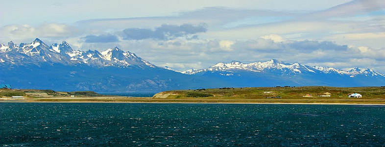 body of water under white cloudy sky during daytime thumbnail