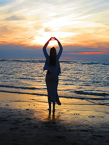 woman raising her hands thumbnail