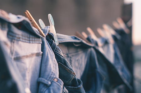 blue denim bottoms hanged on black cable thumbnail
