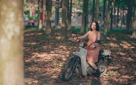 Woman Riding Motorcycle thumbnail