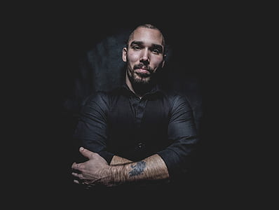 man wearing black dress shirt and waist vest thumbnail