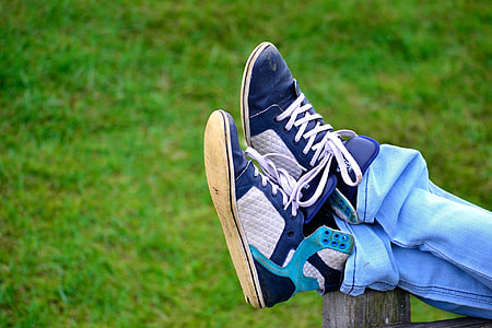 person wearing blue-and-gray high-top sneakers thumbnail