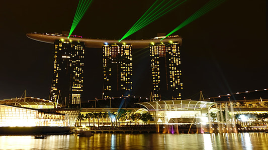 landscape photography of a city with lights and three high-rise buildings thumbnail