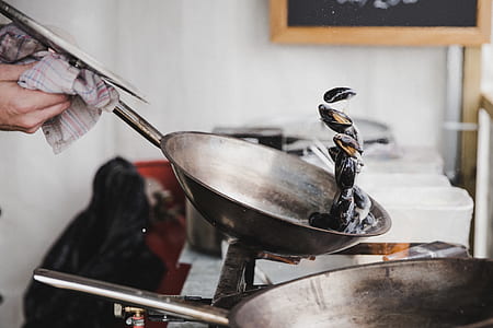 person cooking on pan thumbnail