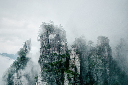 mountain top covered with fog thumbnail