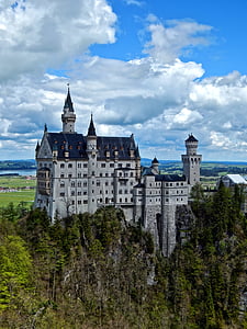 white and blue castle on top of mountain thumbnail