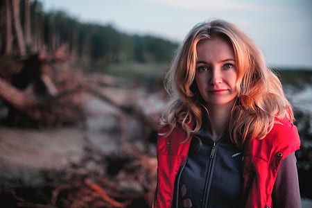selective focus photography of woman in red vest thumbnail