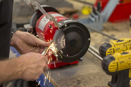 person using bench grinder thumbnail
