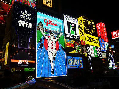 multi-colored billboard shining during night time thumbnail