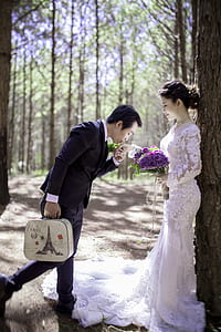 focus photo of wedding couple on forest thumbnail