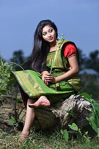 Woman Sitting On Log thumbnail