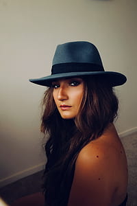 brunette haired woman wearing fedora hat thumbnail