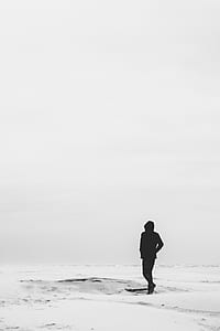 person walking on white sands thumbnail