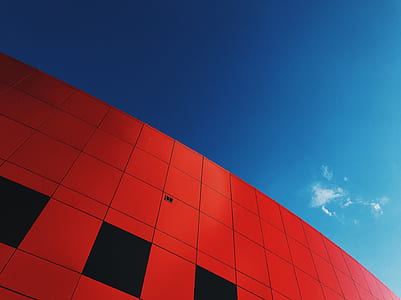 low-angle photography of red concrete building thumbnail
