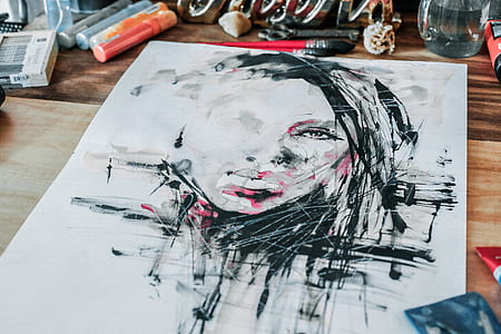 woman's face illustration on table thumbnail