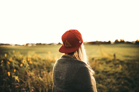 Woman in Gray Cardigan and Red Snapback Cap thumbnail