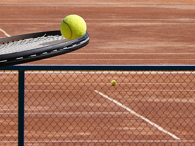 black tennis racket and ball thumbnail