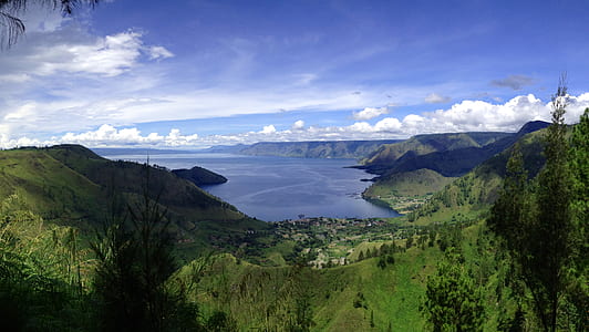 aerial photography of houses near body of water thumbnail