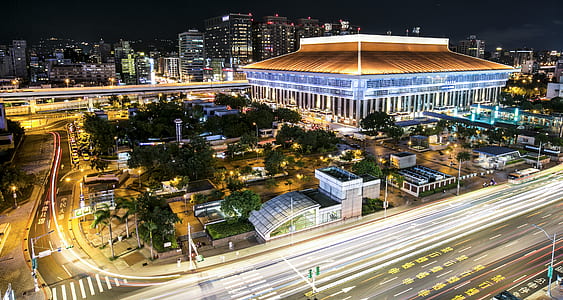 low light photography of buildings and road thumbnail
