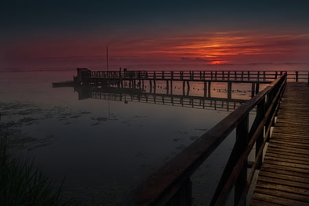 brown sea dock during golden hour thumbnail