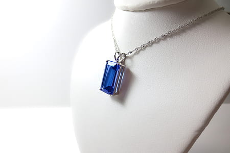 silver necklace with blue gemstone pendant thumbnail
