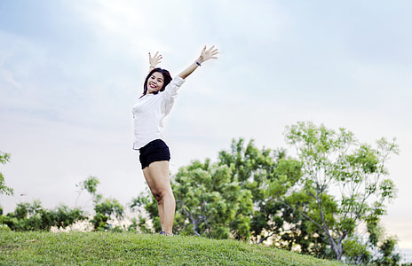 woman standing on grass field thumbnail