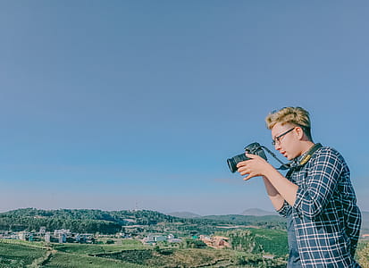 Man Uses Nikon Dslr Camera thumbnail