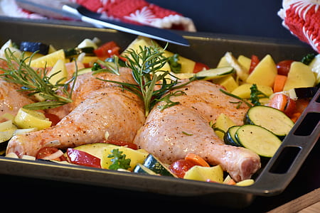 cooked chicken on black steel tray thumbnail