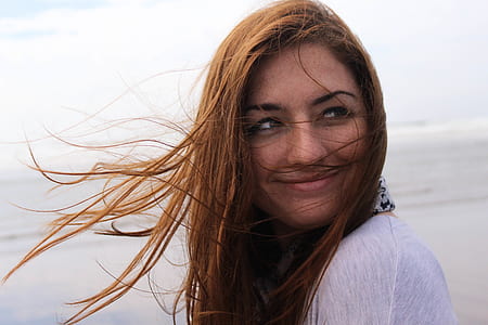selective focus photography of woman on seashore thumbnail
