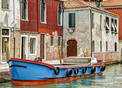 blue and red boat in dock thumbnail