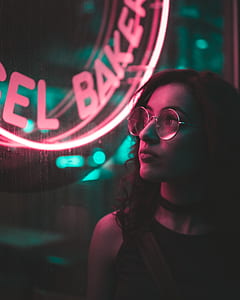 woman in eyeglasses looking at window thumbnail