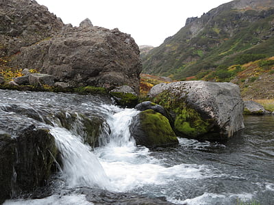 waterfalls near land and mountain thumbnail