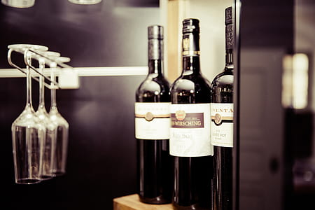 three white and black labelled wine bottles thumbnail