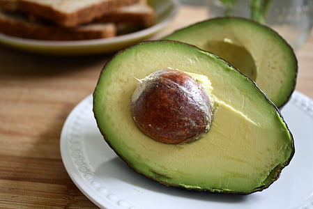 sliced avocado on white plate thumbnail
