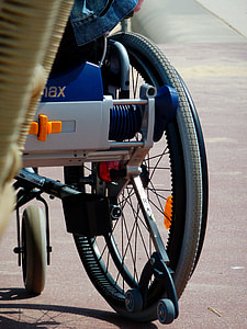person sitting on wheelchair during daytime thumbnail