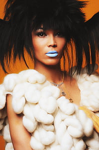 woman wearing white fur vest thumbnail
