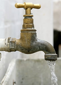 brass-colored metal open water faucet thumbnail