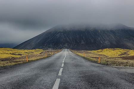 A road with mountains in the background in Iceland thumbnail