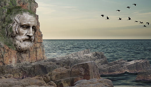 embossed human face mountain cliff landmark thumbnail