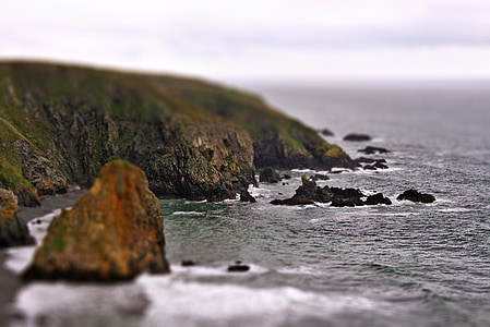 selective focus photography of green mountain thumbnail