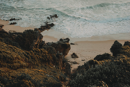 top view photo of rocky cliff near body of water thumbnail