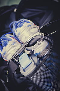 white and black plastic sports bottles in black bag thumbnail