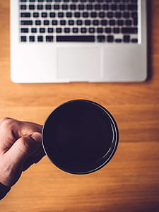person holding black ceramic mug thumbnail