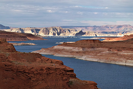 body of water surrounded by mountains thumbnail