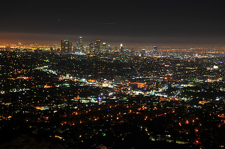 aerial photography of high rise buildings at night time thumbnail