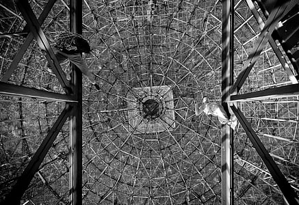 grayscale photography of two men sitting on scaffold thumbnail
