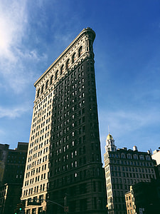 skyscraper under cloudy sky thumbnail