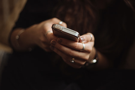 person holding gray smartphone thumbnail