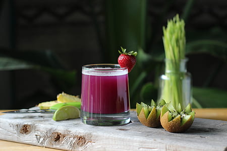 filled clear drinking glass and strawberry fruit top thumbnail