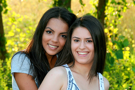 two woman smiling beside each other thumbnail